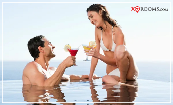honeymoon couple enjoying in pool in hotel in Goa | best Honeymoon Offers for Goa